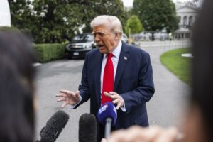 US President Trump speaks to media as he departs White House for UK