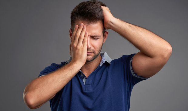 63589498 - a handsome young man feeling sad and desperate